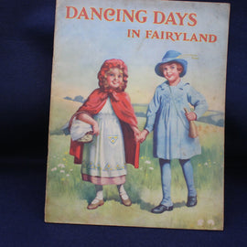 Book cover titled 'Dancing Days in Fairyland' with two children holding hands in a field.
