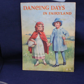 Book cover titled 'Dancing Days in Fairyland' with illustrations of two children on a blue background