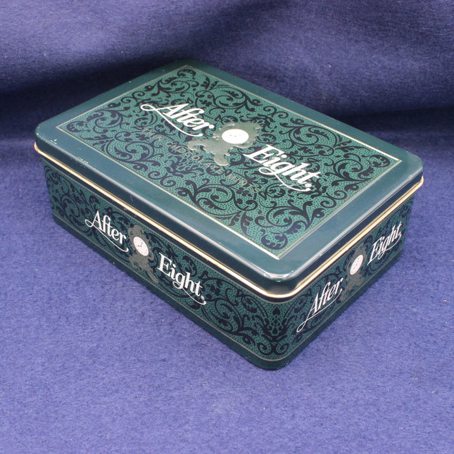 Decorative green box with 'After Eight' branding on a purple background