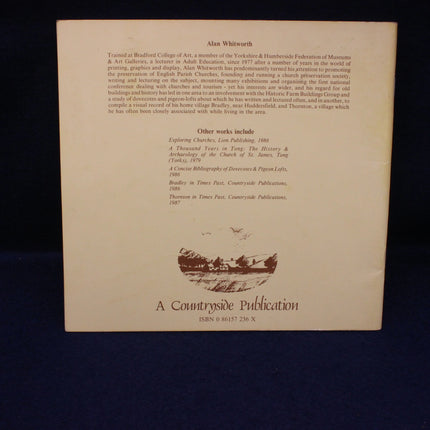 Back cover of a book with text and a landscape illustration on a dark background