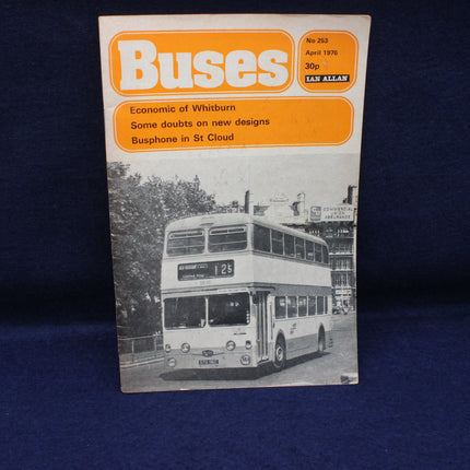 Vintage magazine cover featuring a double-decker bus on a blue background