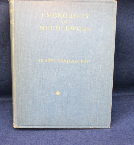 Book titled 'Embroidery and Needlework' by Gladys Windsor Fry on a blue background