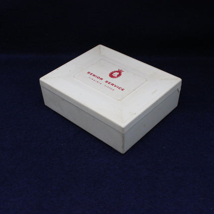 White box with a red logo and text on a dark blue background