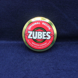 Zubes lozenge container lid on a blue background