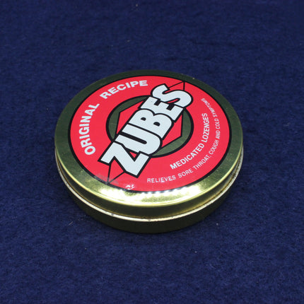 Zubes lozenge tin with red label on a blue background