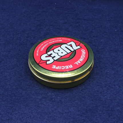 Zubs Original Recipe container lid on a blue background