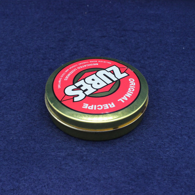 Zubs Original Recipe container lid on a blue background