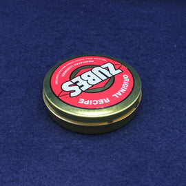 Zubs Original Recipe container lid on a blue background