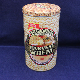 Finn Crisp Harvest Wheat crispbread canister on a blue background