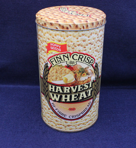 Finn Crisp Harvest Wheat crispbread canister on a blue background