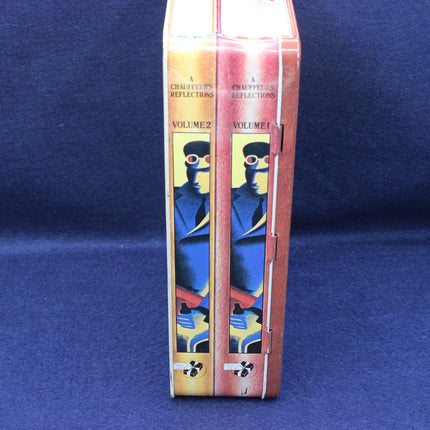 Two books titled 'Chanteurs de la Terre' with colorful covers on a blue background