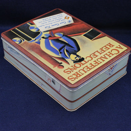 Decorative tin box with artistic design on a dark blue background