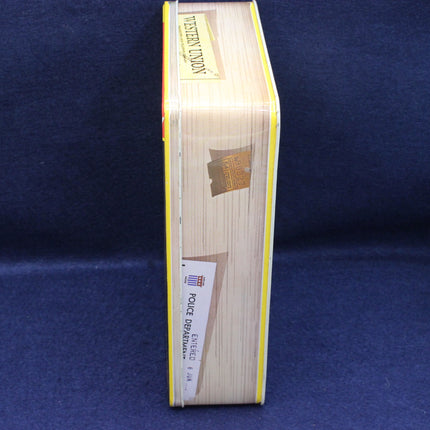 Wooden style tin with brand label on a blue background