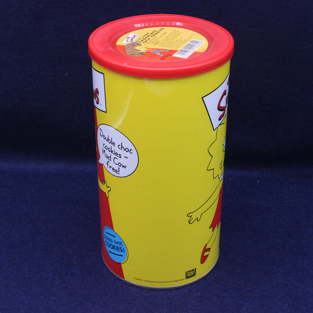 Yellow cookie canister with red lid on a dark blue background