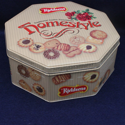 Kjeldsen's Homestyle cookie tin with illustrations of cookies on a dark blue background