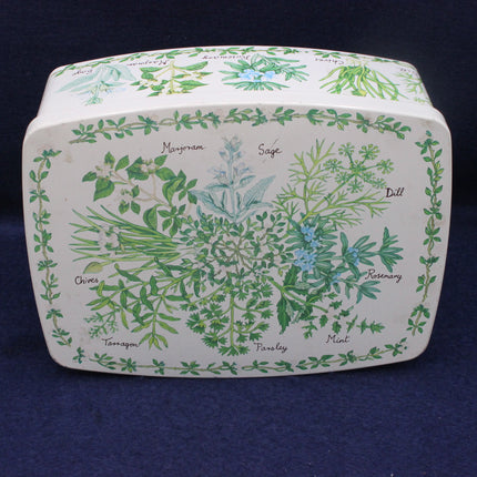 Decorative box with herb illustrations and names on a dark background