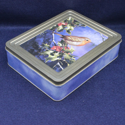 Rectangular tin box with a Christmas design featuring a robin and holly on a blue background