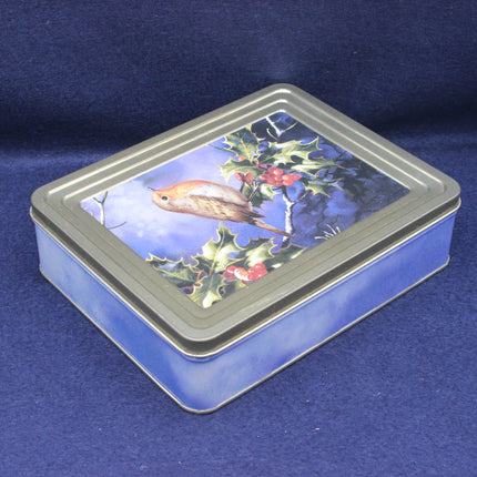 Rectangular tin box with a bird and holly design on a blue background