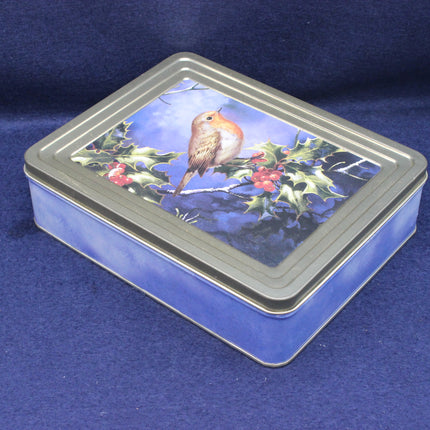 Rectangular tin box with a bird and holly design on a blue background