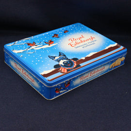 Scotty Dog wearing a chequered scarf on a shortbread biscuit tin