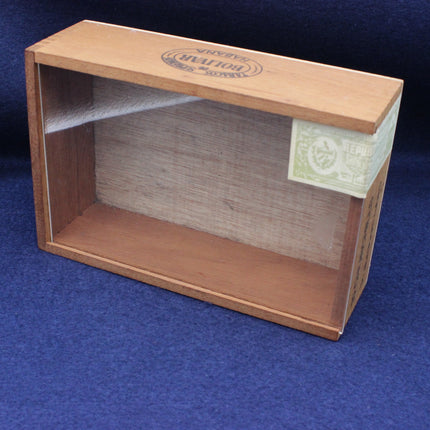 Cigar box with clear lid on a blue background