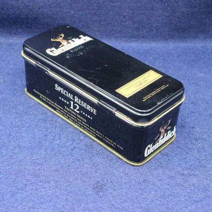 Glenfiddich Special Reserve 12-year-old whiskey tin on a blue background