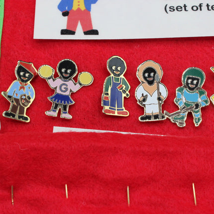Set of colorful character pins on a red background