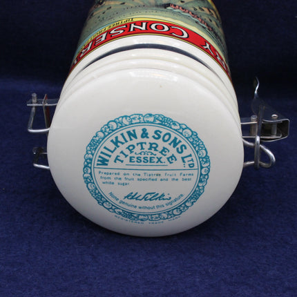 Close-up of a container with 'Wilkin & Sons Ltd' branding on a blue background