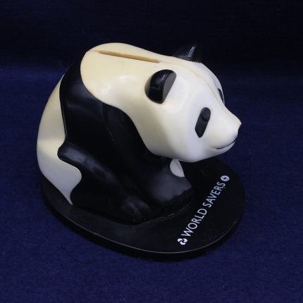 Close‑up of panda money box slot and detailing, capturing nostalgic character and charm.
