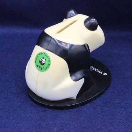 Angled shot of vintage panda money box highlighting collectable banking memorabilia style.