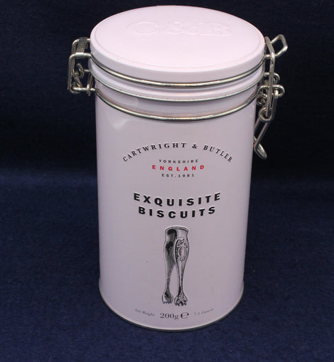 	Close‑up of tin lid with Cartwright & Butler logo and timeless decorative finish