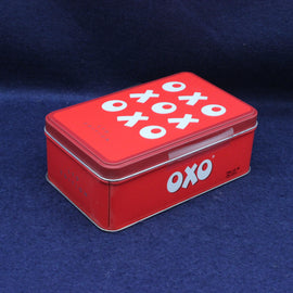 Front view of Oxo Cubes Limited Edition storage tin with bold red and white retro branding.