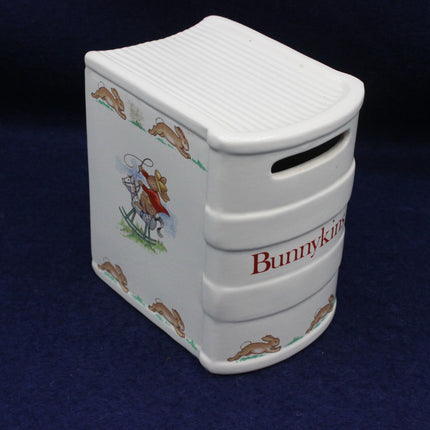 Bunnykins branding on the front of a money box