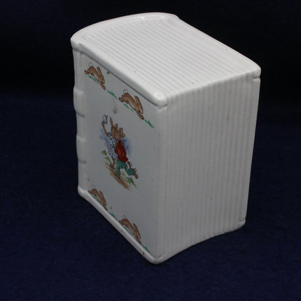 Little cartoon rabbits on a white money box