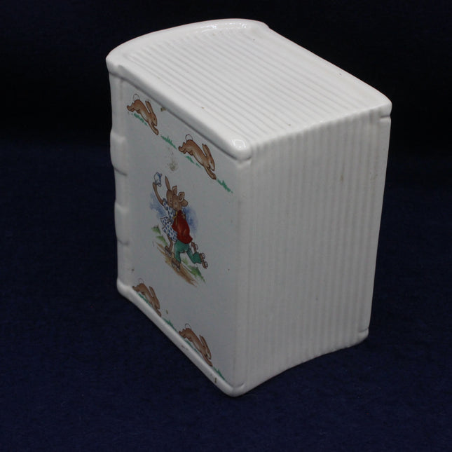 Little cartoon rabbits on a white money box