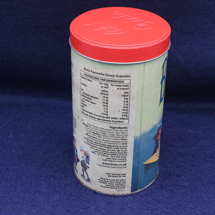 Canister of Bisto gravy granules with a red lid on a blue background