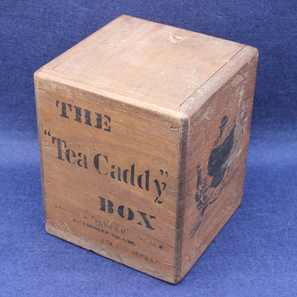 Wooden tea caddy box with text on a blue background