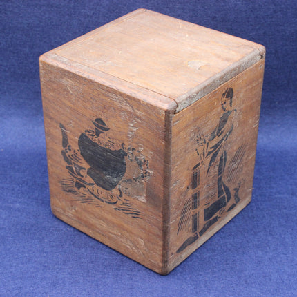 Wooden box with engraved designs on a blue background