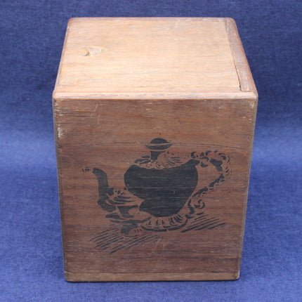 Wooden tea box with teapot design on a blue background