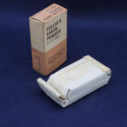 Fuller's Earth Powder box and bar on a blue background
