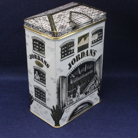Vintage Jordan's tobacco tin with detailed illustrations on a dark blue background