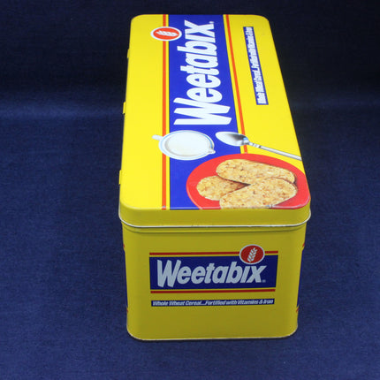 Weetabix cereal tin on a dark blue background