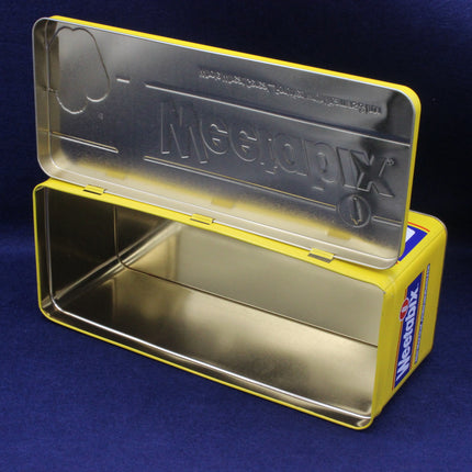 Yellow and silver container on a blue background