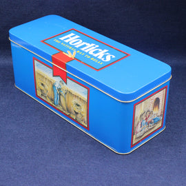 Blue Horlicks tin with vintage illustrations on a blue background