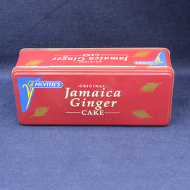 Red tin box of Jamaica Ginger Cake on a blue background