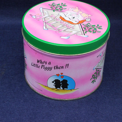 Pink tin can with cartoon design on a blue background