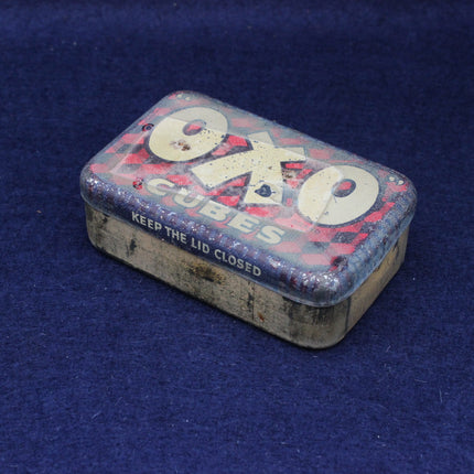 Vintage Oxo cubes tin on a blue background