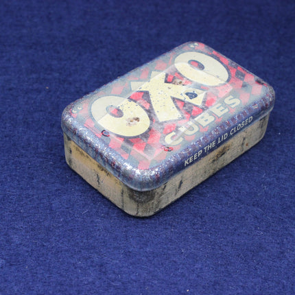 Vintage OXO salt cube tin on a blue background