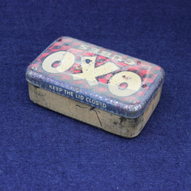 Vintage Oxo tin on a blue background