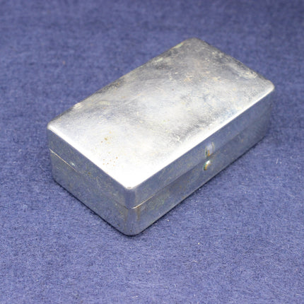 Rectangular metal box on a blue background